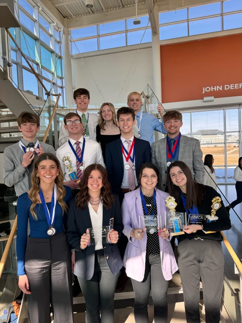 Students holding awards and medals