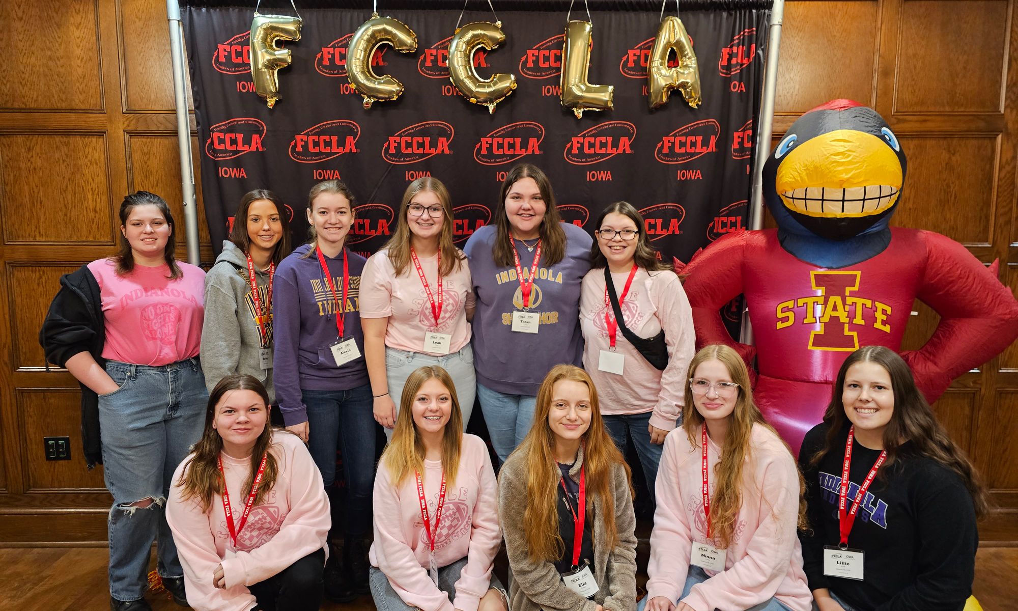 fccla Group of students by CY statue in front of FCCLA banner