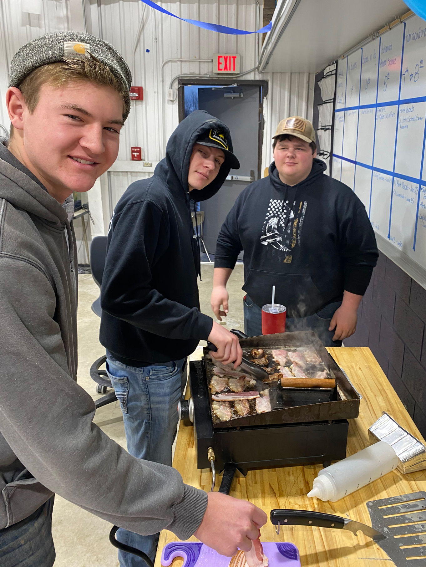 guys-cooking students cooking on a grill